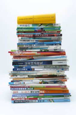 Fuji-Shi, Shizuoka-Ken, Japan - August 9, 2022: Stacked Japanese school books. Isolated on white background.