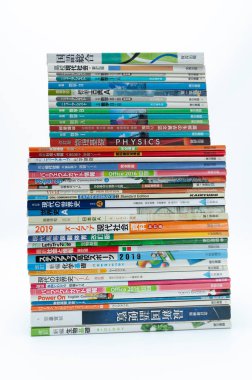 Fuji-Shi, Shizuoka-Ken, Japan - August 9, 2022: Stacked Japanese school books. Isolated on white background.