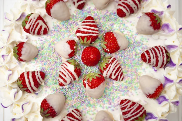 Sweet Surprises: Delicious Birthday Cake with Confetti and Fresh Strawberry Toppings.