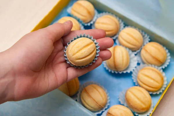 nut with condensed milk in hand