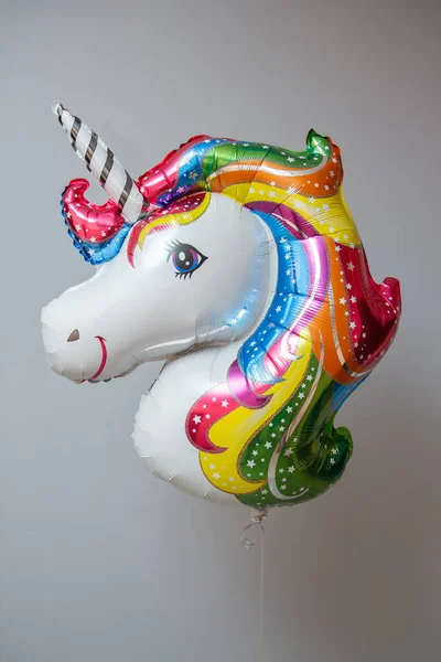 white unicorn foil balloon with helium