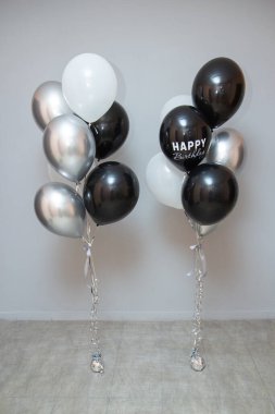 set of black and silver birthday balloons