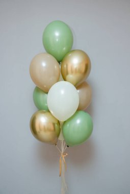 card with balloons for the holiday, balloons with helium on a gray background