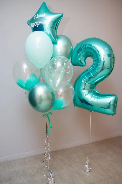 a bunch of mint-colored balloons, the inscription on the balloon \