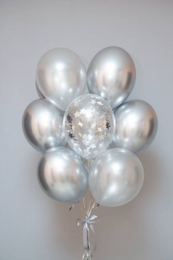 silver chrome balloons, steel color helium balloons on the floor