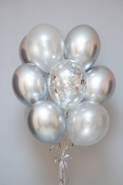 silver chrome balloons, steel color helium balloons on the floor