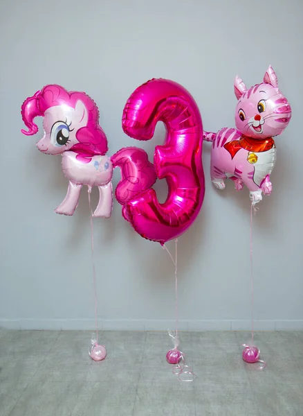 pink balloons in the room on the floor, foil balloon cat and pony, pink foil number 3
