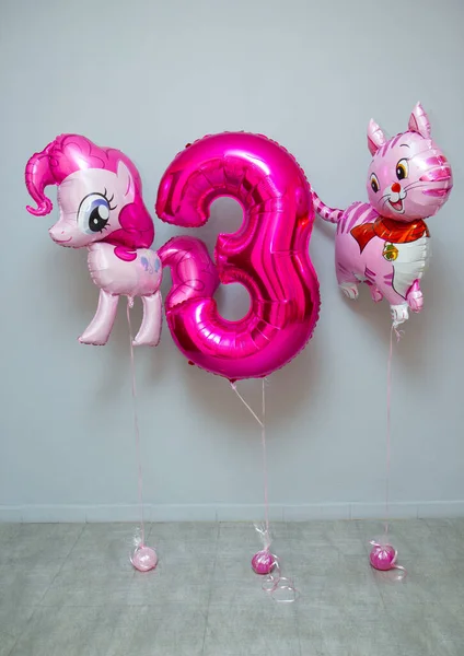 pink balloons in the room on the floor, foil balloon cat and pony, pink foil number 3