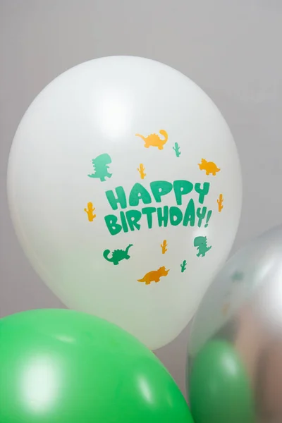card with balloons, dinosaurs on a white latex balloon