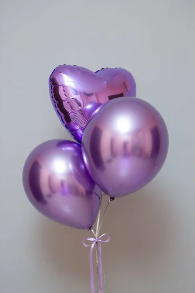 purple balloons on wall background, card with balloons