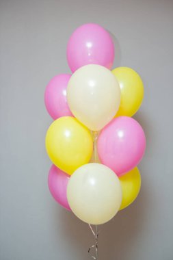Set of pink and yellow balloons. Decorations from balloons for a girl
