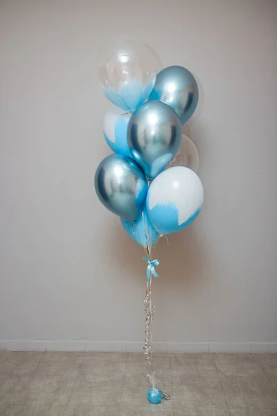 stock image blue and chrome balloons in the room