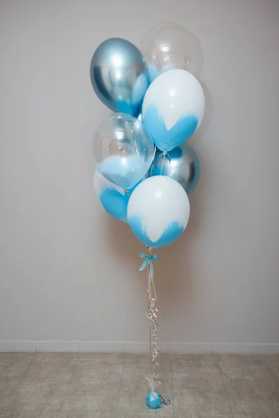 stock image blue and chrome balloons in the room