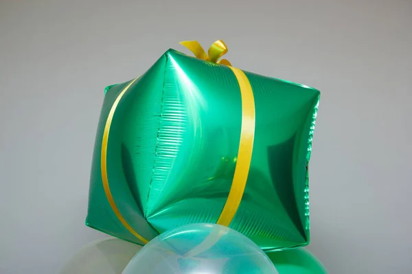 stock image green square balloon with bow