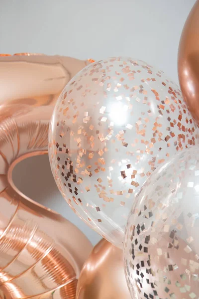 golden and white balloons on white background, rose gold helium balloons