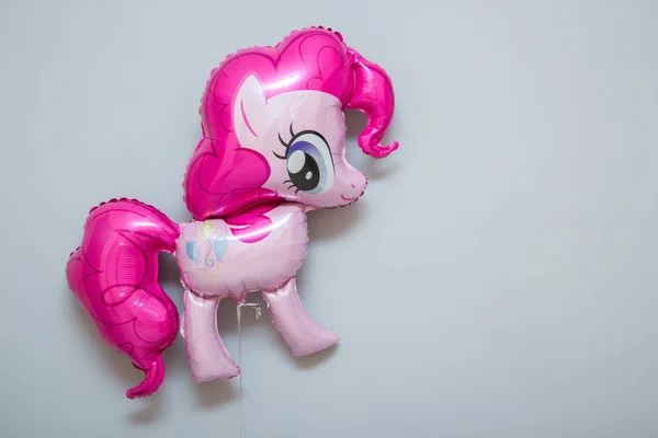 pony with pink mane balloon on white background