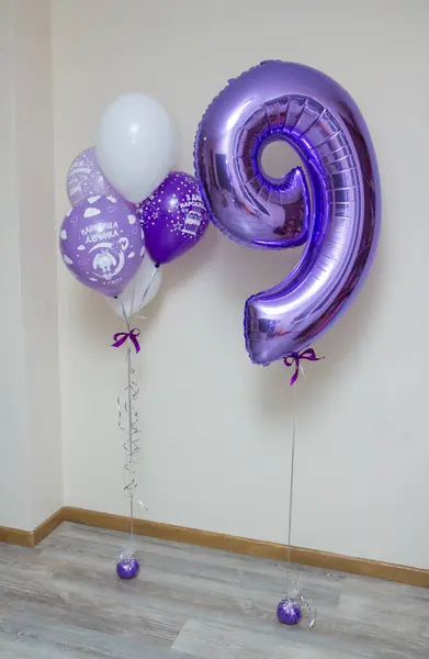 purple number 9 balloon, purple balloons, inscription on the balloon \