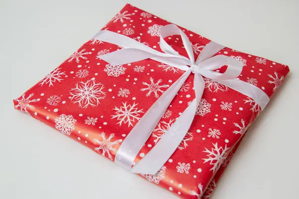 Christmas gifts in wrapping paper with bow
