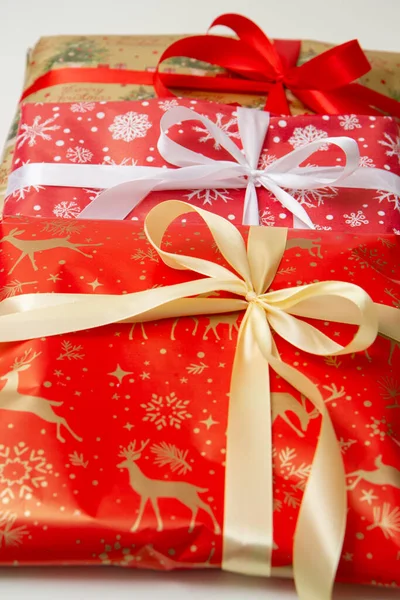 Christmas gifts in wrapping paper with bow
