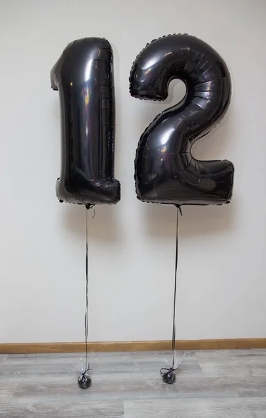 black numbers 12, foil number balloons with black helium