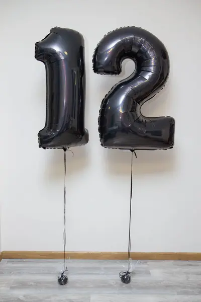 black numbers 12, foil number balloons with black helium