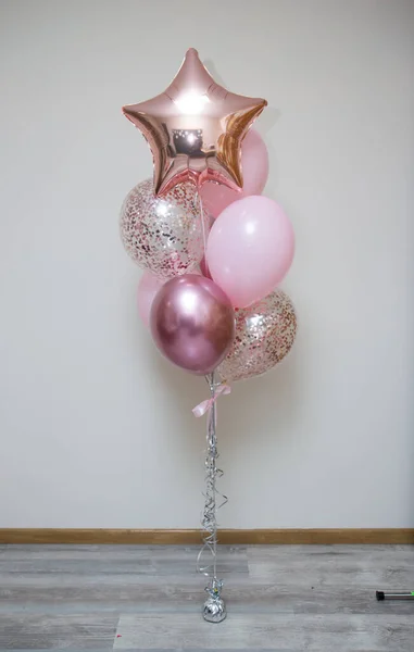 bunch of pink balloons with helium on a white background