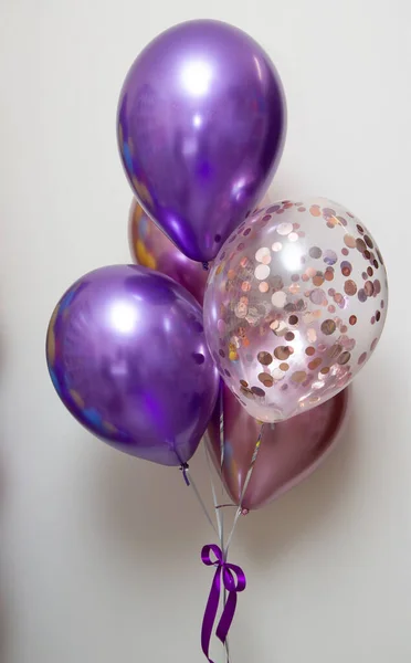 chrome balloons with helium on a white background