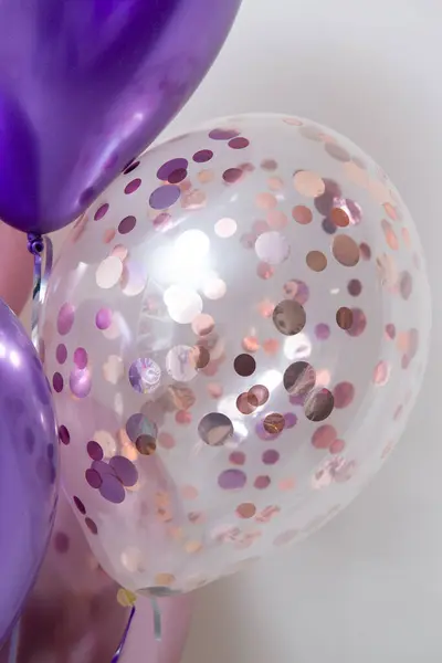 chrome balloons with helium on a white background