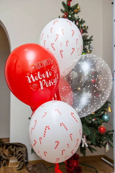red and white balloons, the inscription on the balloon \