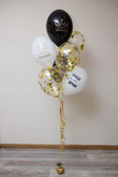 birthday balloons with compliments. Inscriptions on the balloons: I wish your dreams come true, Only the stars are higher, You are just space