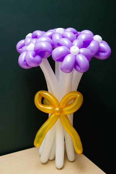 bouquet of purple flowers from balloons, flowers from balloons