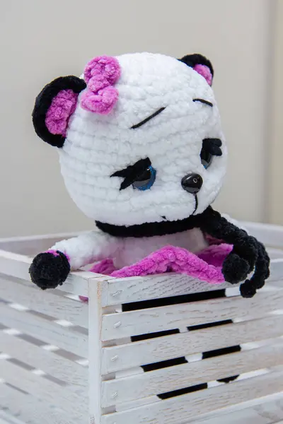 plush toy panda in a white box