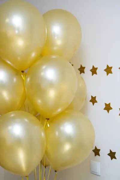 mother of pearl gold balloons with gold ribbons