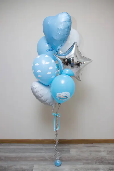a set of blue and white balloons for discharge from the maternity hospital on a white background, the inscription \