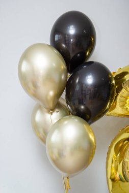 gold and black balloons, gold numbers 25