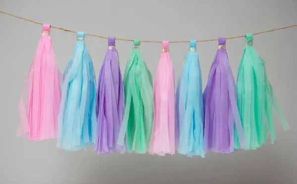 Stock image bright paper tassel garland for holiday decor