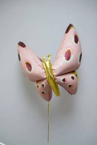 stock image pink butterfly balloon on white background