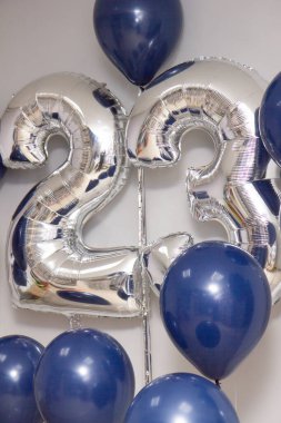 silver number 23 balloons and a bouquet of blue latex helium balloons clipart