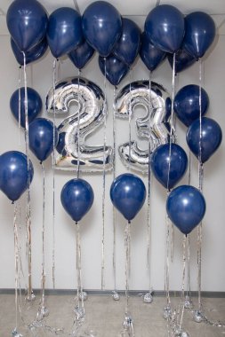 silver number 23 balloons and a bouquet of blue latex helium balloons clipart