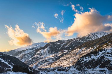 Beautiful winter scenery with El tarter village and mountains illuminated by sunset. Ski winter holidays in Andorra, Pyrenees Mountains