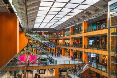 Andorra la Vella, Andorra, Jan 2020 People shopping in modern, multi floor shopping mall or a gallery in a capital city. Pyrenees Mountains