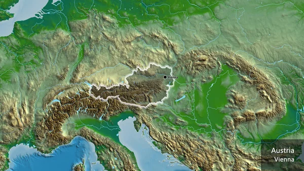 物理的な地図上の暗いオーバーレイで強調オーストリア国境地域のクローズアップ 資本ポイント 国の形の周りに光る 英名国とその首都 — ストック写真