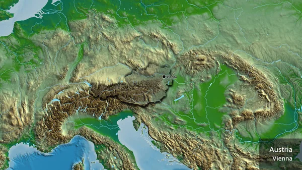 物理的な地図上の暗いオーバーレイで強調オーストリア国境地域のクローズアップ 資本ポイント 国の形の縁が隠されています 英名国とその首都 — ストック写真