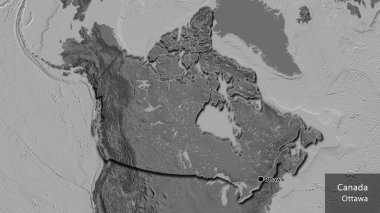 Kanada sınır bölgesinin bir bileklik haritasına yakın plan. Ana nokta. Kırsal kesimin kıvrımlı kenarları. Ülkenin ve başkentinin İngilizce adı