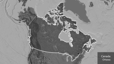 Kanada sınır bölgesinin yakın çekimleri, bilek haritasında koyu bir örtüyle vurgulanıyor. Ana nokta. Ülke çapında parıldıyor. Ülkenin ve başkentinin İngilizce adı