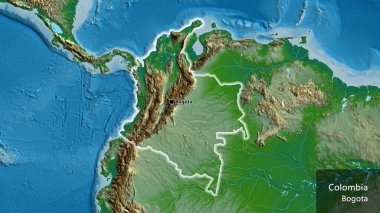 Kolombiya sınırına fiziksel bir haritayla yakın plan. Ana nokta. Ülke çapında parıldıyor. Ülkenin ve başkentinin İngilizce adı