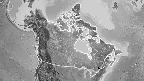 在一张灰色比例尺地图上对加拿大边境地区进行的密切调查 资本点 风靡全国 — 图库照片