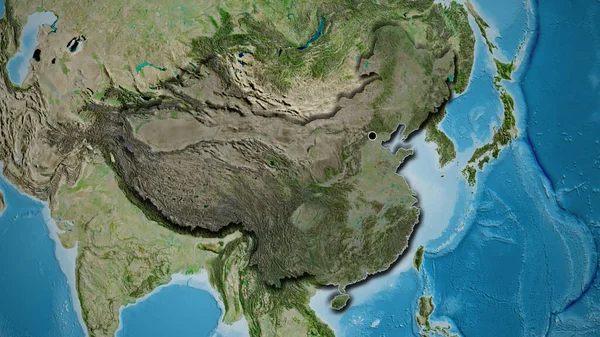 Close-up of the China border area highlighting with a dark overlay on a satellite map. Capital point. Bevelled edges of the country shape.
