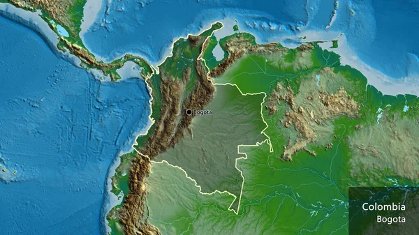 コロンビアの国境地帯のクローズアップは 物理的な地図上の暗いオーバーレイで強調しています 資本ポイント 国の形の周りの概要 英名国とその首都 — ストック写真