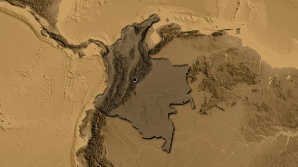 コロンビアの境界領域のクローズアップは セピアの標高地図上の暗いオーバーレイで強調しています 資本ポイント 国の形の縁が隠されている — ストック写真